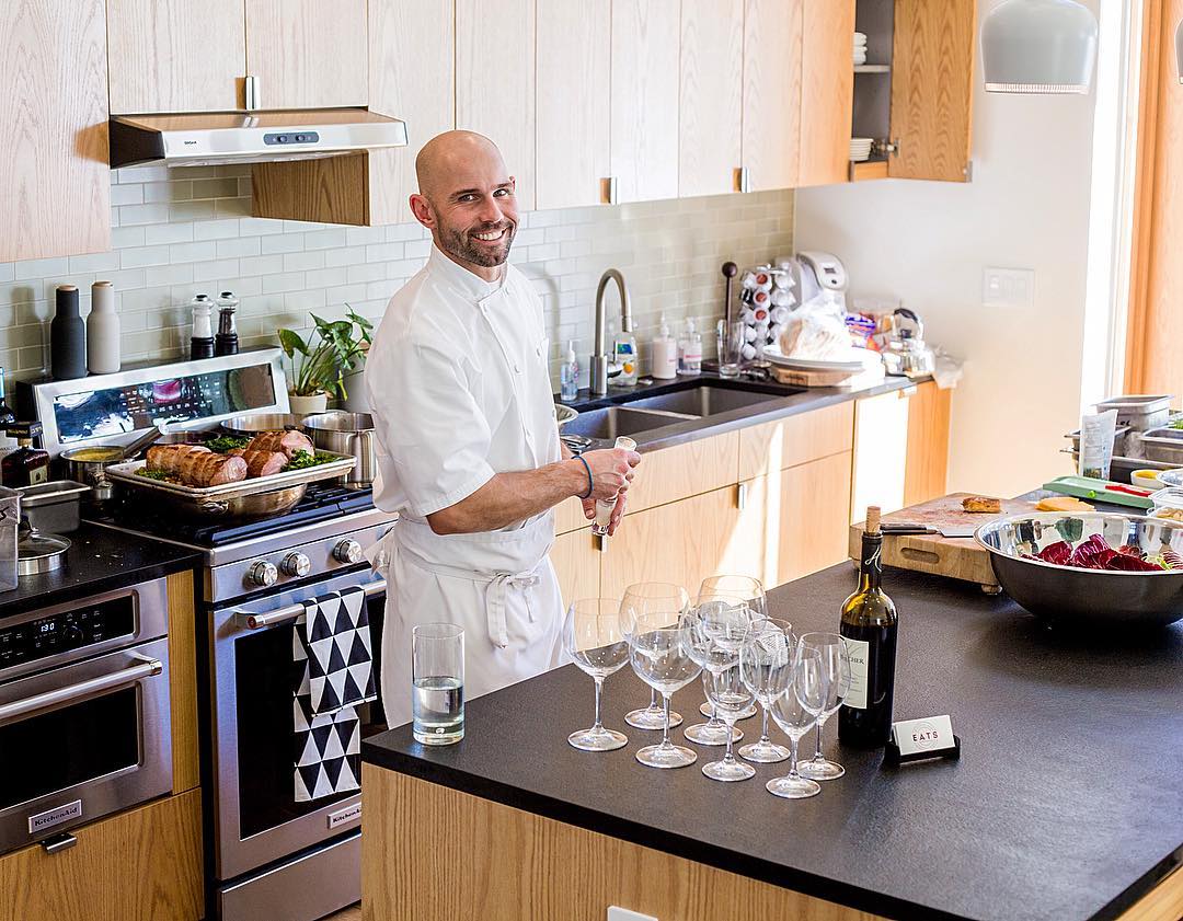 Chef Tommy cooking a tasting dinner in a client's kitchen